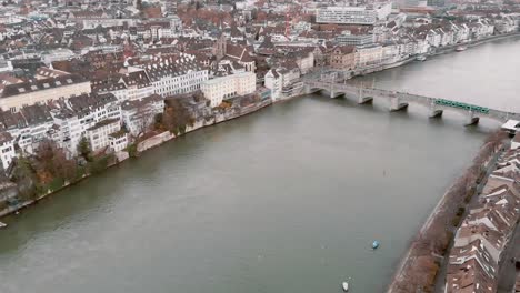 Fly-over-Historic-Middle-Bridge-across-Rhine-River,-Basel,-Switzerland