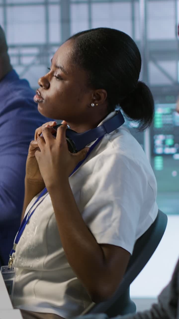 Vertical video Admin in data center drinking coffee and implementing AI systems