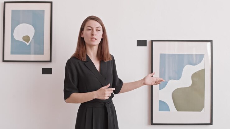 Woman Hosting Online Presentation of Exhibition