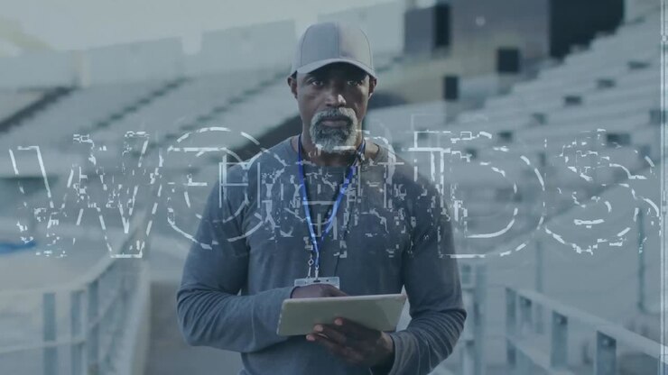 Animation of fight text over african american male coach with tablet
