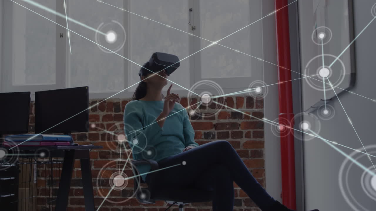 Animation of network of connections over businesswoman using vr headset in office