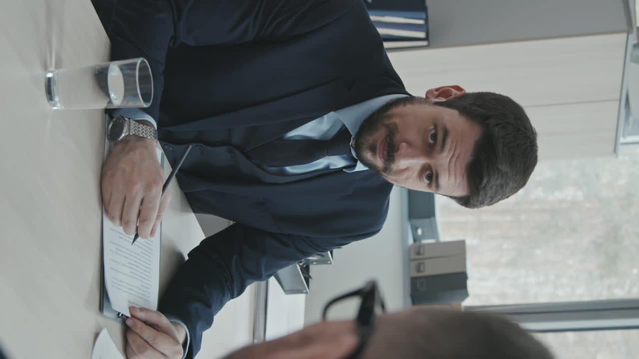 Male Attorney Consulting Client at Business Meeting