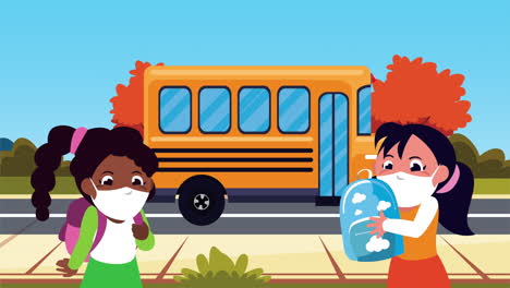 little students girls wearing medical masks with bus characters
