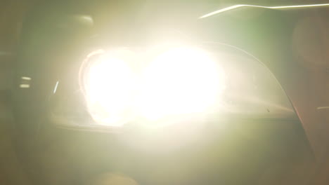 car headlights shining into the camera