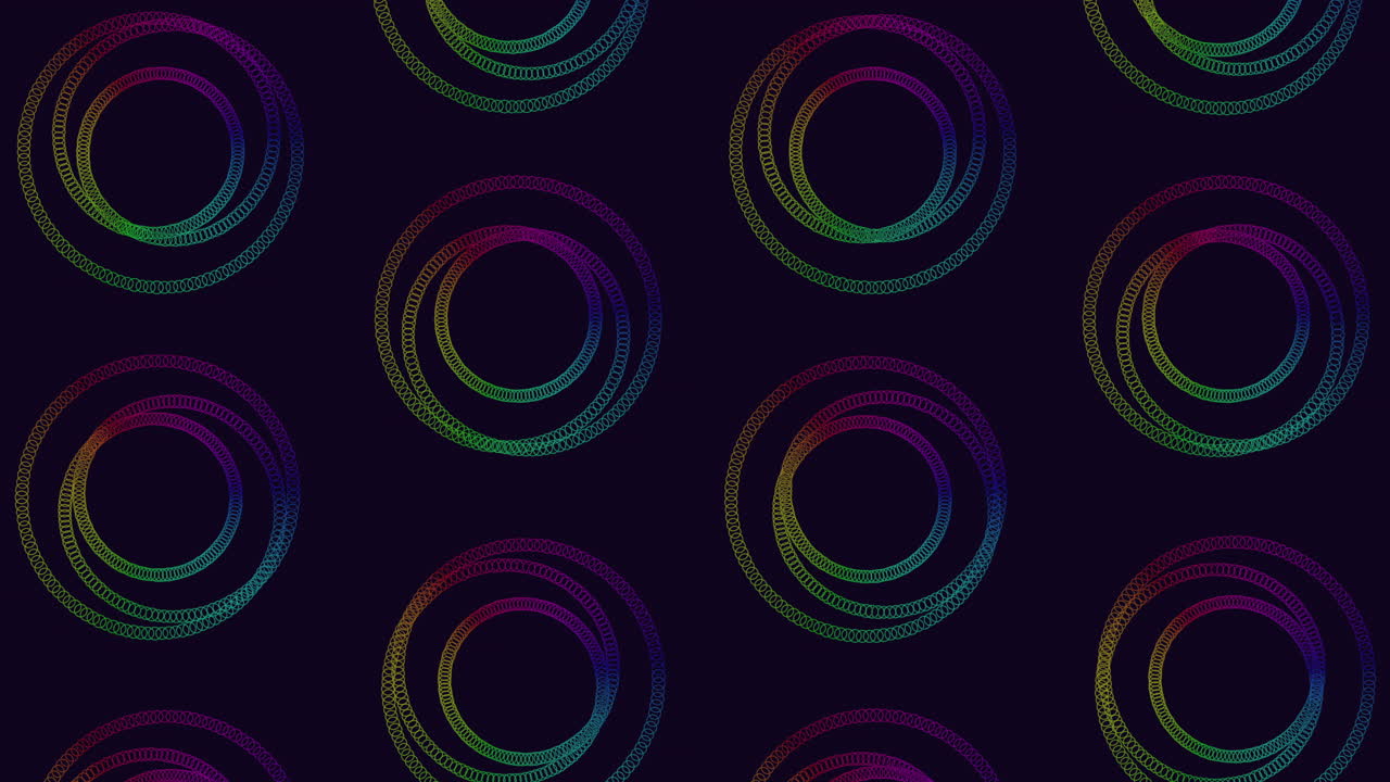 patrón espiral colorido de círculos superpuestos sobre un fondo negro