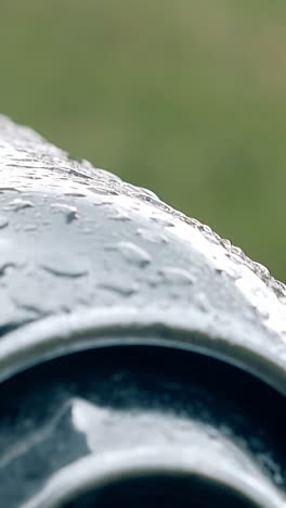 water drops on a curved metal surface