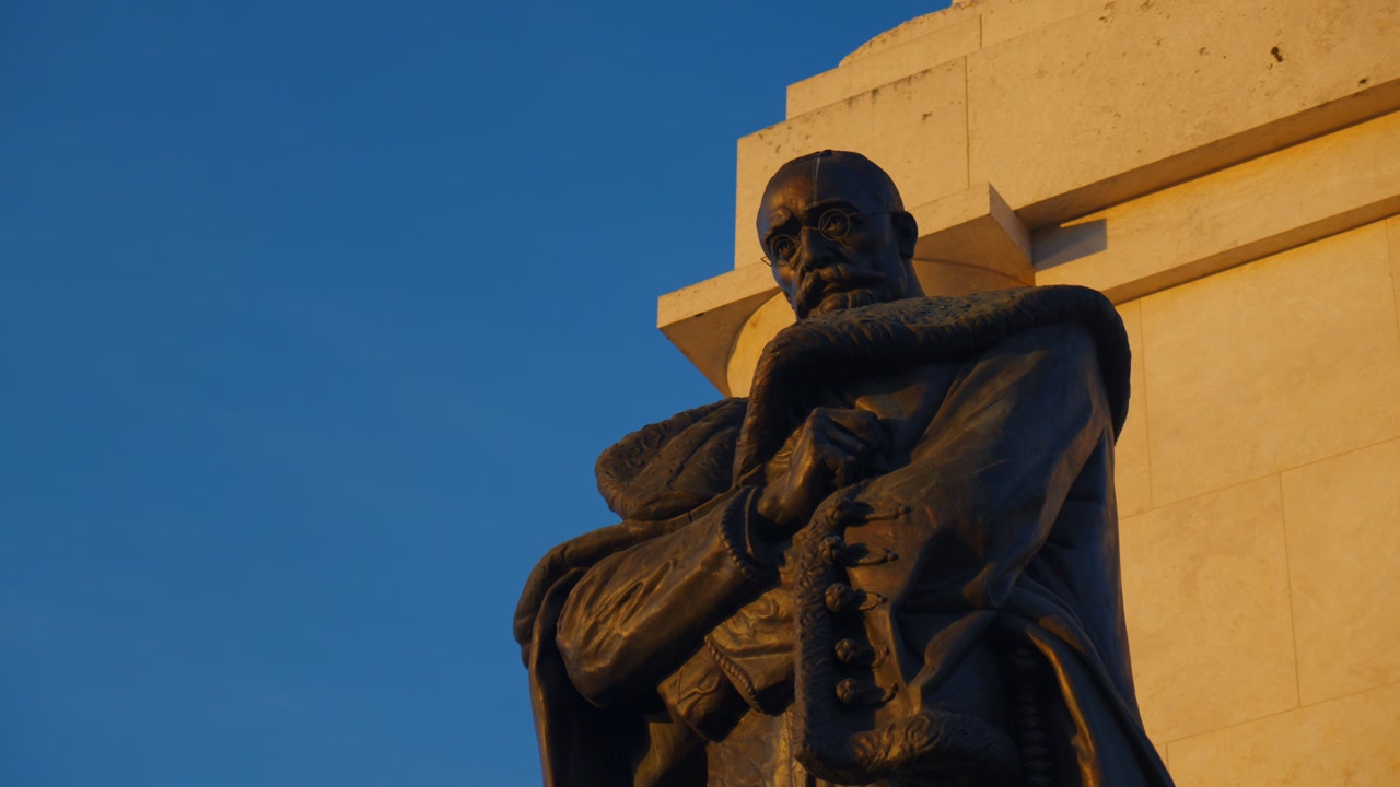 Close up of historic statue in Budapest illuminated by warm golden hour sunlight