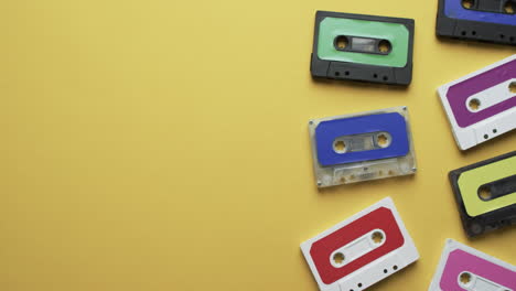 Video-of-retro-tapes-with-copy-space-on-yellow-background