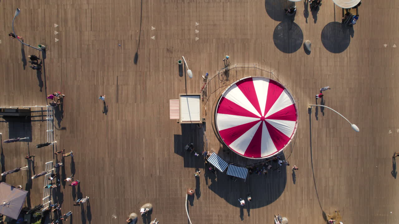 First Hebrew Carousel in Tel Aviv Port, this is a classic horse carousel specially designed for the port, with a sap, a milkman's cart, sofas, horses and an old car - top down shot