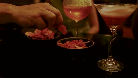 enjoying drinks and snacks at a bar