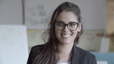 happy young businesswoman smiling at camera