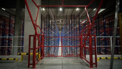 big and modern warehouse under construction, featuring metal shelving and other industrial equipment.