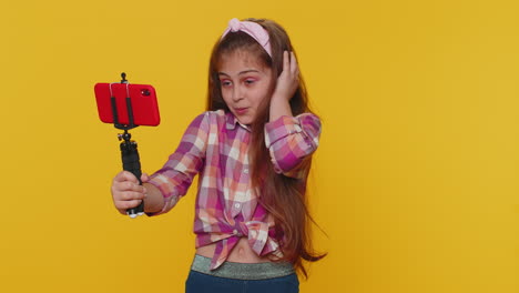 child girl kid blogger taking selfie on smartphone communicating video call online with subscribers