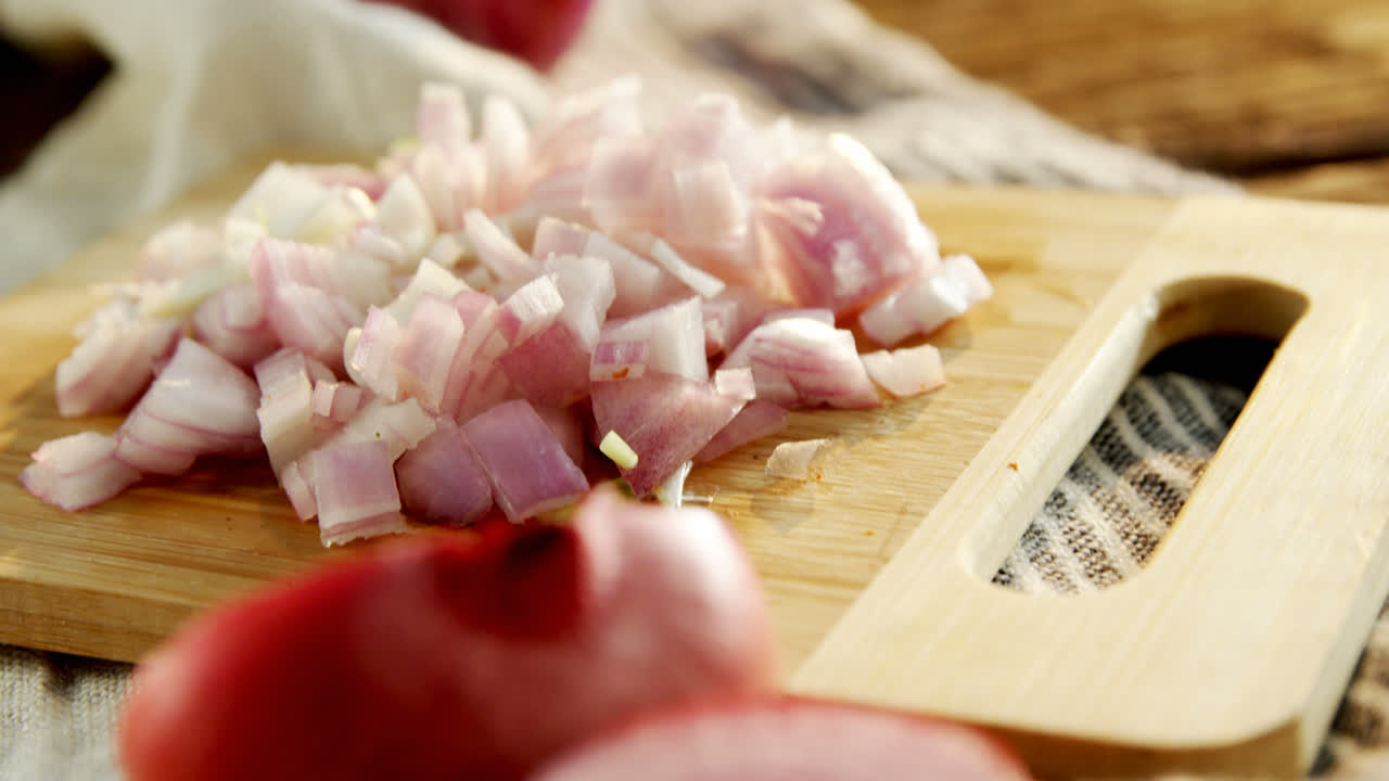 Chopped onion on chopping board 4k