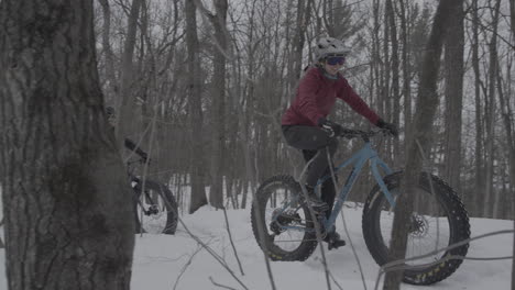 friends cycling in the winter - fatbikes in the snow