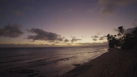 the-sun-setting-on-the-coastline-in-Hawaii-USA-with-pink-sky-and-reflections-on-the-ocean