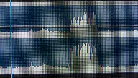 Audio waves on a computer screen. Macro liquid crystal structure IPS matrix with red, blue and green glowing crystals and graphic patterns of the computer's graphic monitor