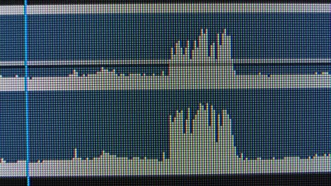 audio waves on a computer screen. macro liquid crystal structure ips matrix with red, blue and green glowing crystals and graphic patterns of the computer's graphic monitor