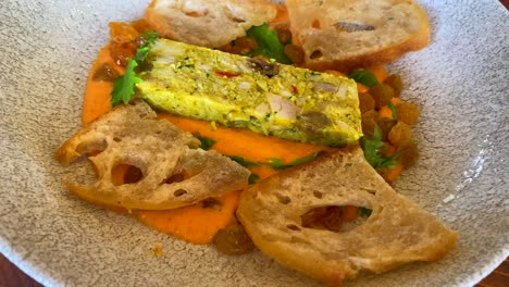 pumpkin cream with raisins, curry chicken and little bread toasts, tasty food, 4k shot