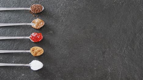 various cookies seasoning ingredients in spoon 4k