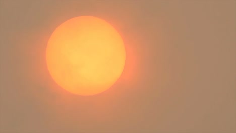 sunlight obscured by sahara dust and wildfire smoke