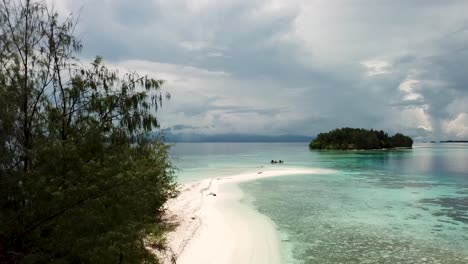 drone shot of lumbaria island, also known as kennedy island where john f. kennedy stranded in world war 2. drone flying along a white sandy beach