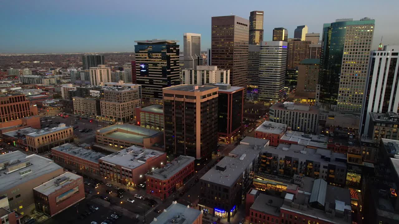 Aerial over the Denver skyline at dusk, Colorado, USA. Drone orbit shot