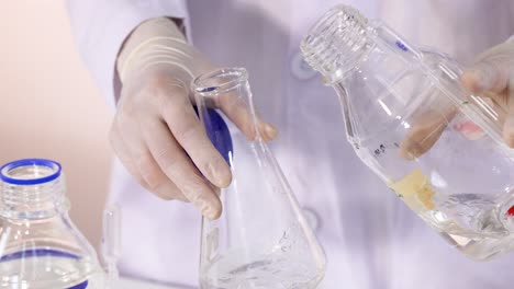 scientist conducts chemical experiment with glassware