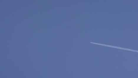 airplane contrail in blue sky