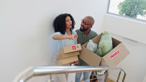 Moving, boxes and couple on stairs in home
