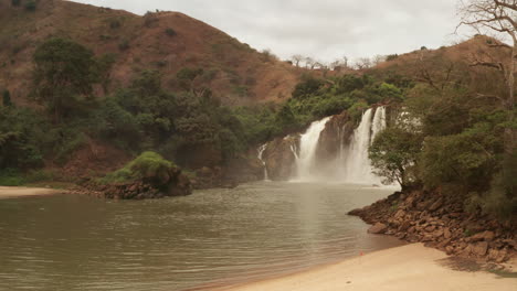 Flying-over-a-waterfall-in-kwanza-sul,-binga,-Angola-on-the-African-continent-1