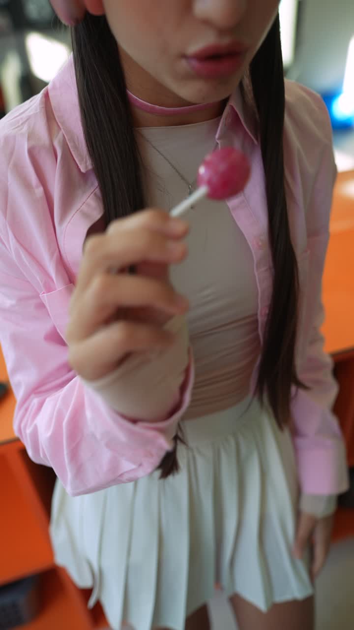Teenage Girl with Pink Lollipop