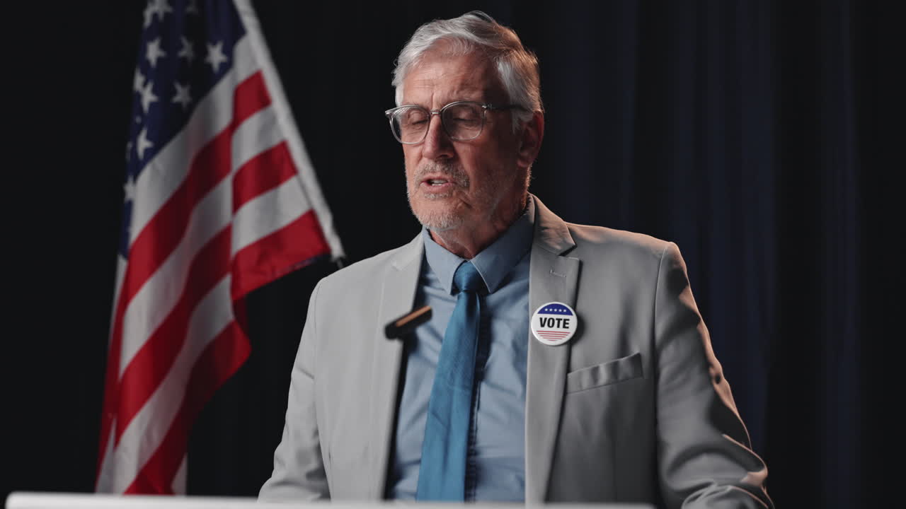 Politician giving a speech with American flag