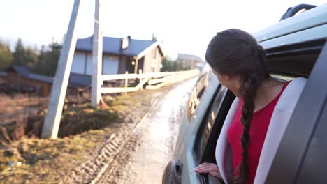 woman enjoying a scenic drive through the countryside