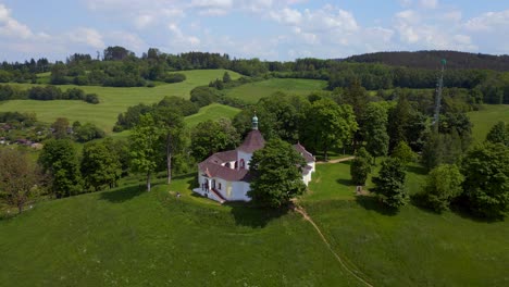 fabulous aerial top view flight round chapel on mountain hill, krumlov czech republic summer 2023