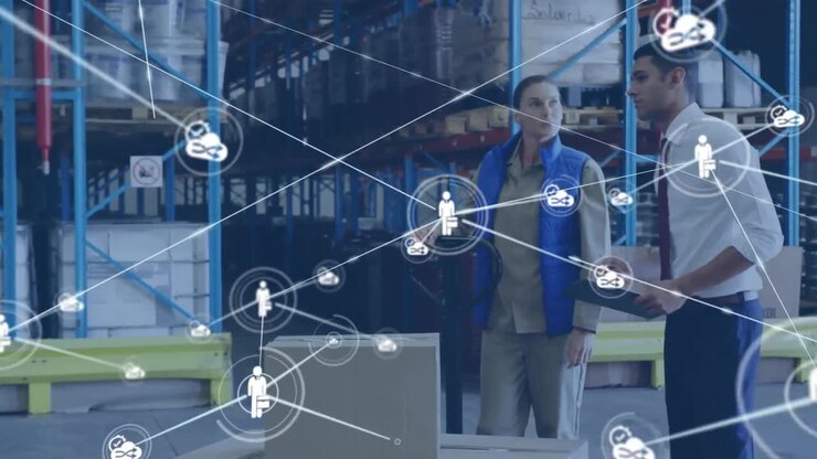 Animation of network of icons over diverse male supervisor and female worker working at warehouse