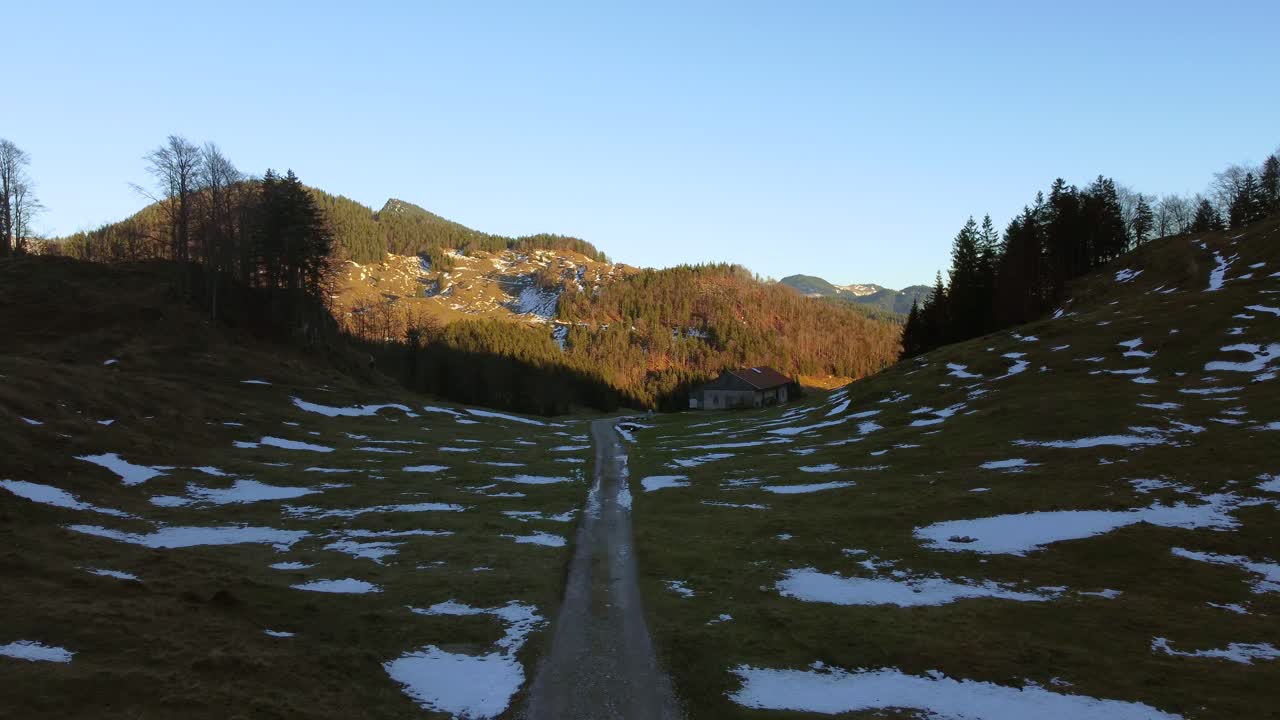 Scenic snowy hills at sunset in the Bavarian Alps in winter in Germany, close to Austria