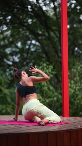 woman practicing yoga outdoors