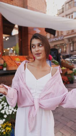 woman talking at a street market