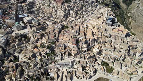 aerial drone top shot showing the whole town of matera, italy