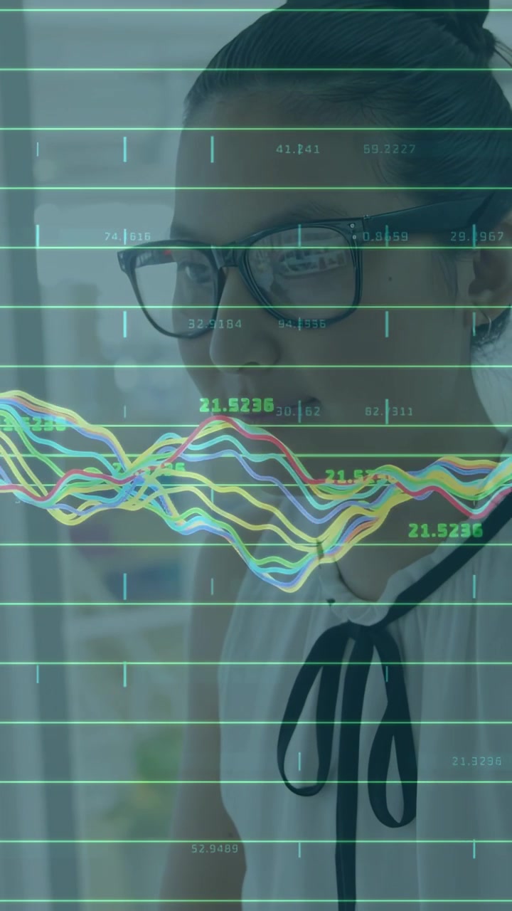Vertical video: Woman viewing screen making graphs on lens, analyzing and sipping bottle for tech