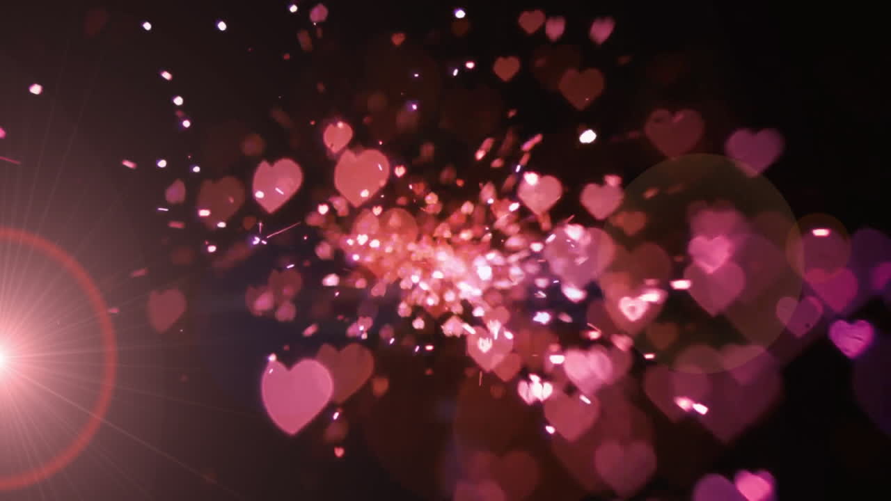 Pink hearts and sparkles animation over dark background, creating magical effect
