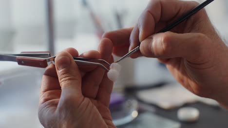 dental technician working on teeth restoration