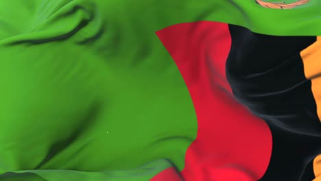 bandera de zambia agitando el viento en lento con el cielo azul, bucle