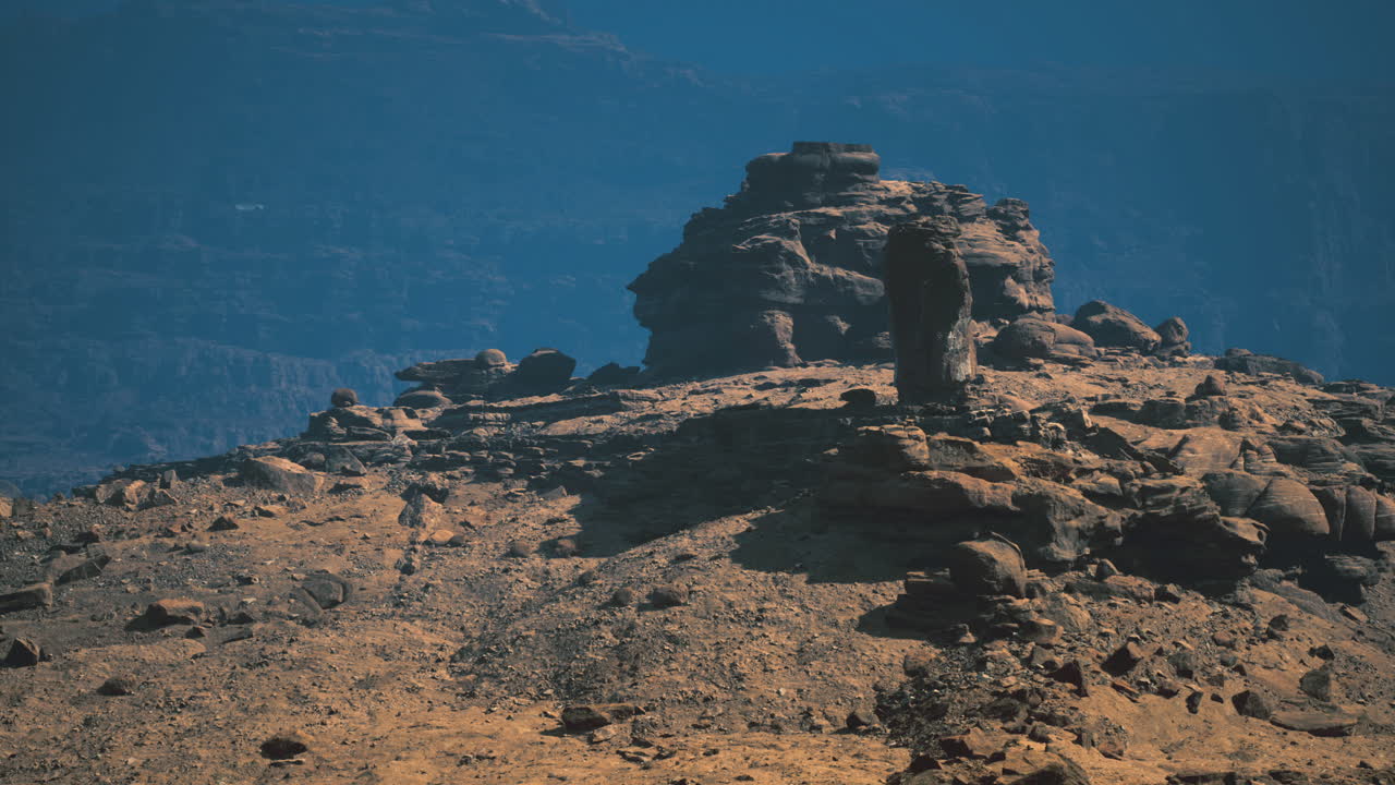 Exploring unique rock formations in a serene desert landscape at sunset