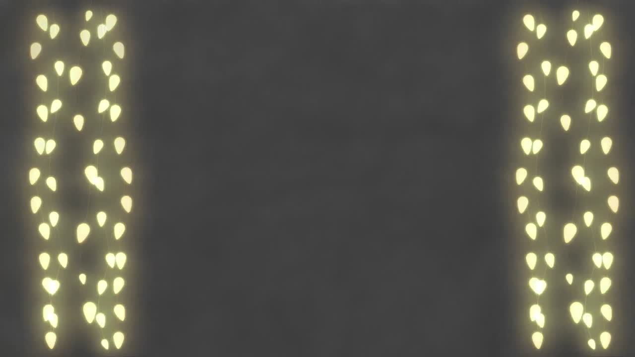 회색 배경에 복사 공간과 함께 크리스마스 요정 불빛의 애니메이션