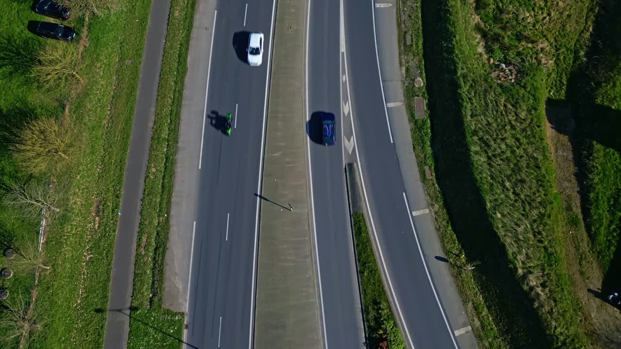 Aerial top-down view of vehicles on multi-lane highway