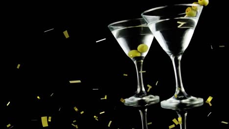 Animation-of-confetti-falling-over-cocktail-glasses-of-wine-and-olives-on-black-background