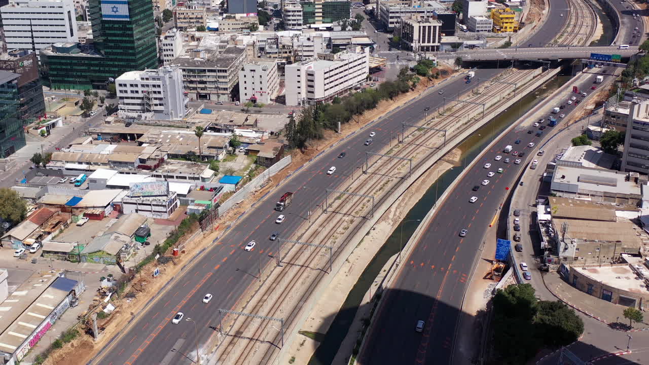 Aerial view of a highway with traffic in an urban area