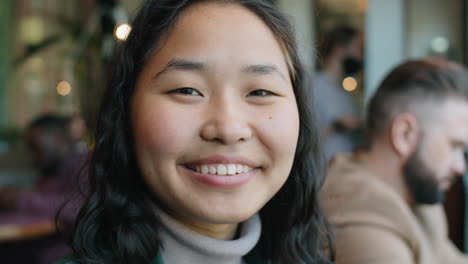 portrait of happy asian woman in cafe